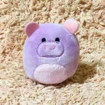 mini squishmallow hanna on brown carpet