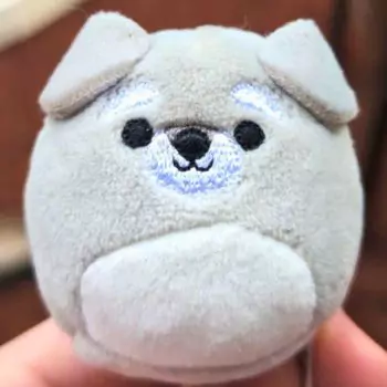 small squishmallow brian in hand