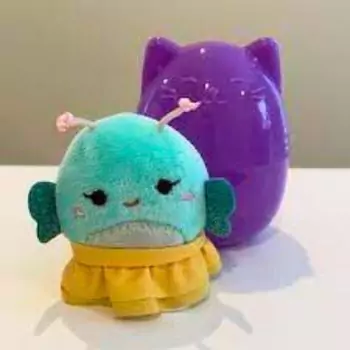 squishville reina with purple mystery squishmallow capsule