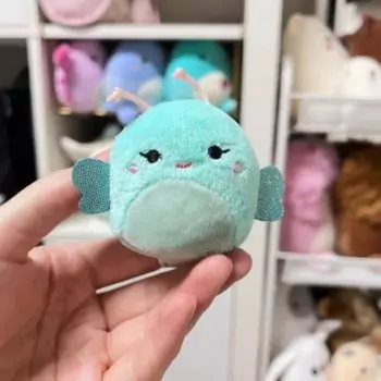 mini squishmallow reina in hand