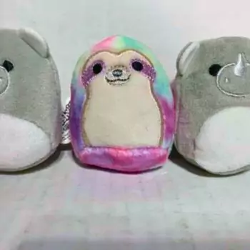 squishville sharie sloth in between mini irving the rhino squishmallows