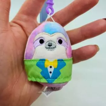 mini squishmallow sharie placed in hand